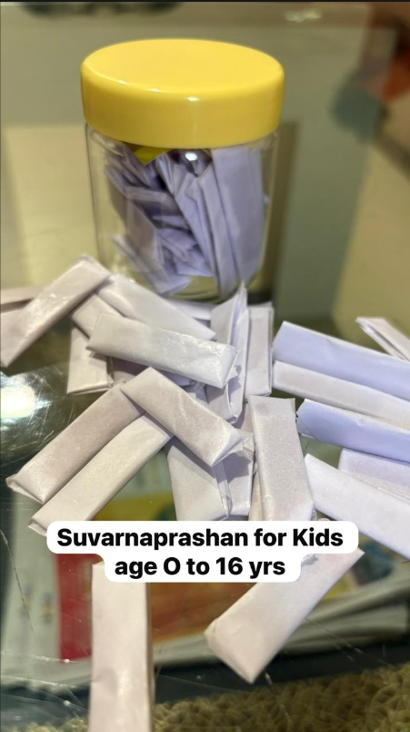 Dr. Nimkar administering Suvarnaprashan to a child — Ayurvedic immunity therapy for kids aged 0–16 years