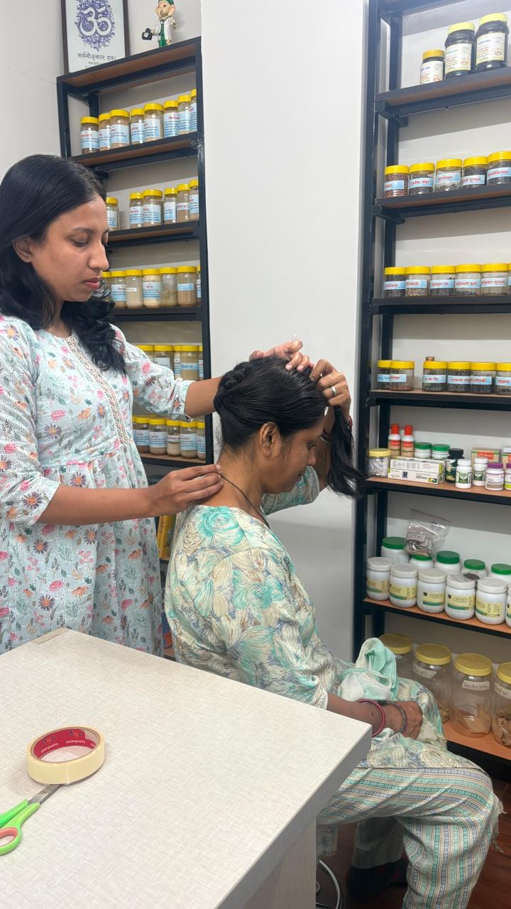 Herbal medicine shelf and treatment area at Saumya Ayurved